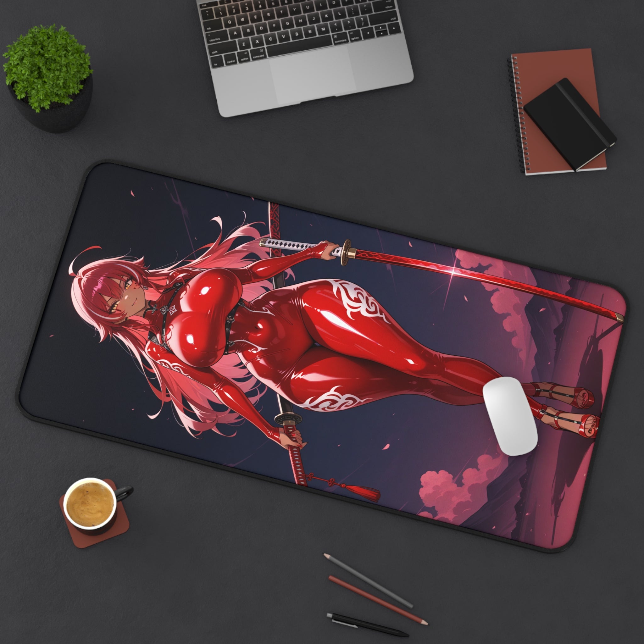 Desk setup with a large mouse pad featuring an anime-style design, laptop, coffee cup, and stationery items on a dark surface.