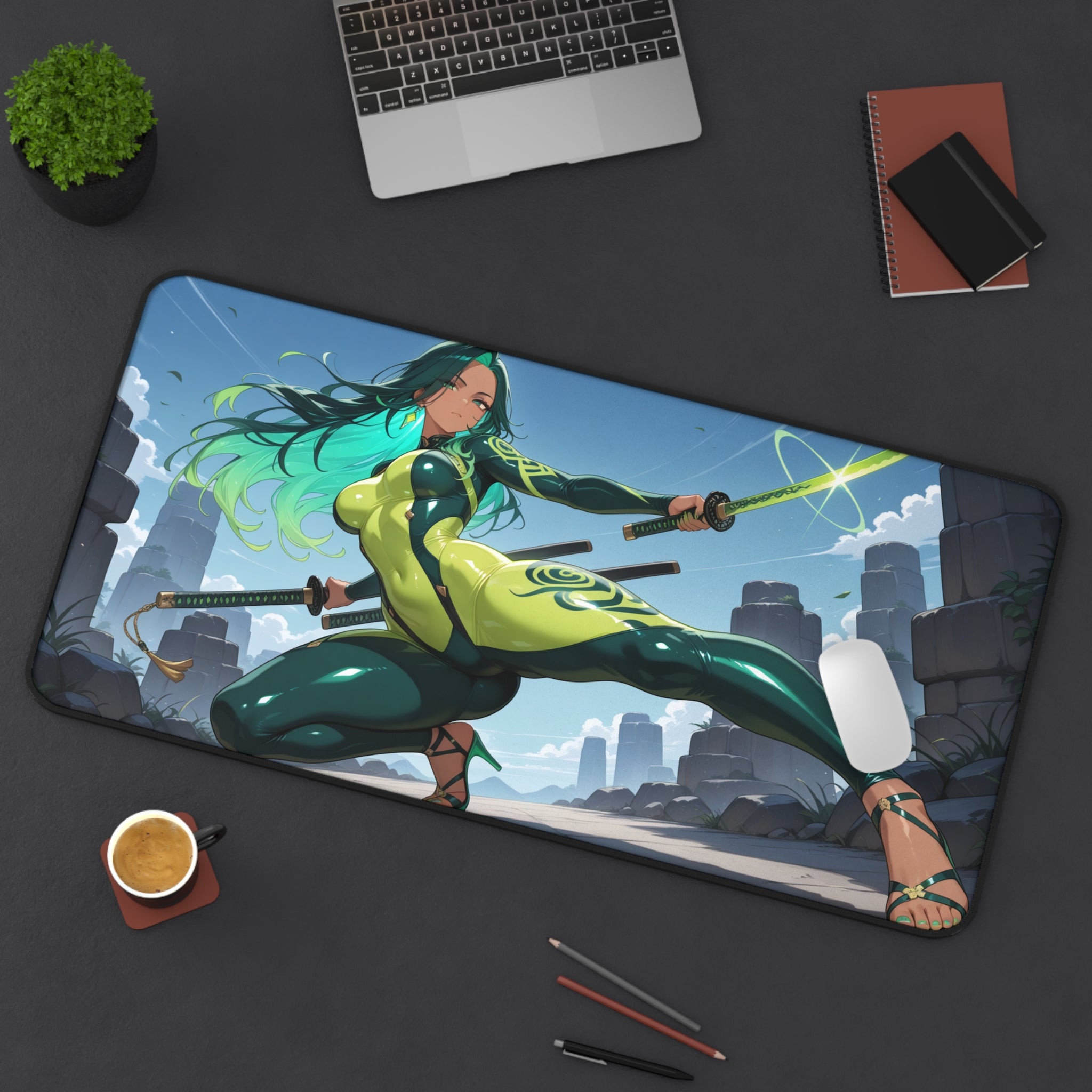 Desk setup with a large mouse pad featuring an animated character, laptop, cup, and stationery items.
