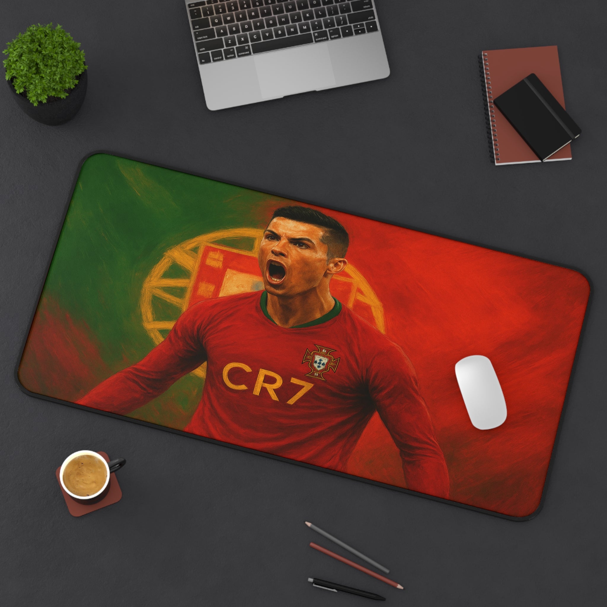 Desk setup with a mouse pad featuring a soccer player in a red jersey, surrounded by office items.