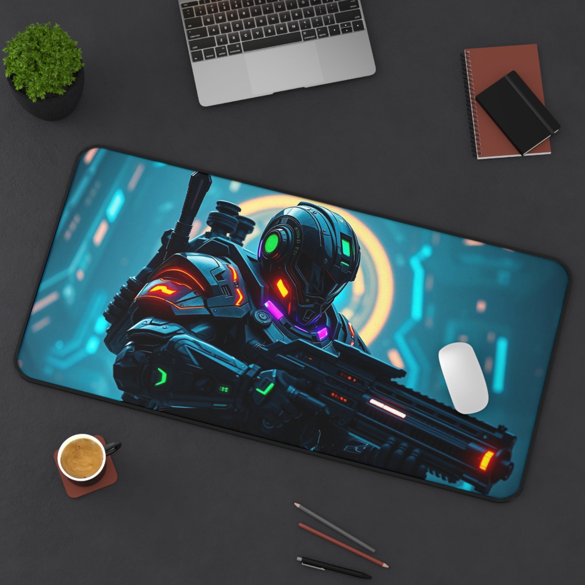 Gaming mouse pad with a futuristic robot design on a desk with a laptop and other items.
