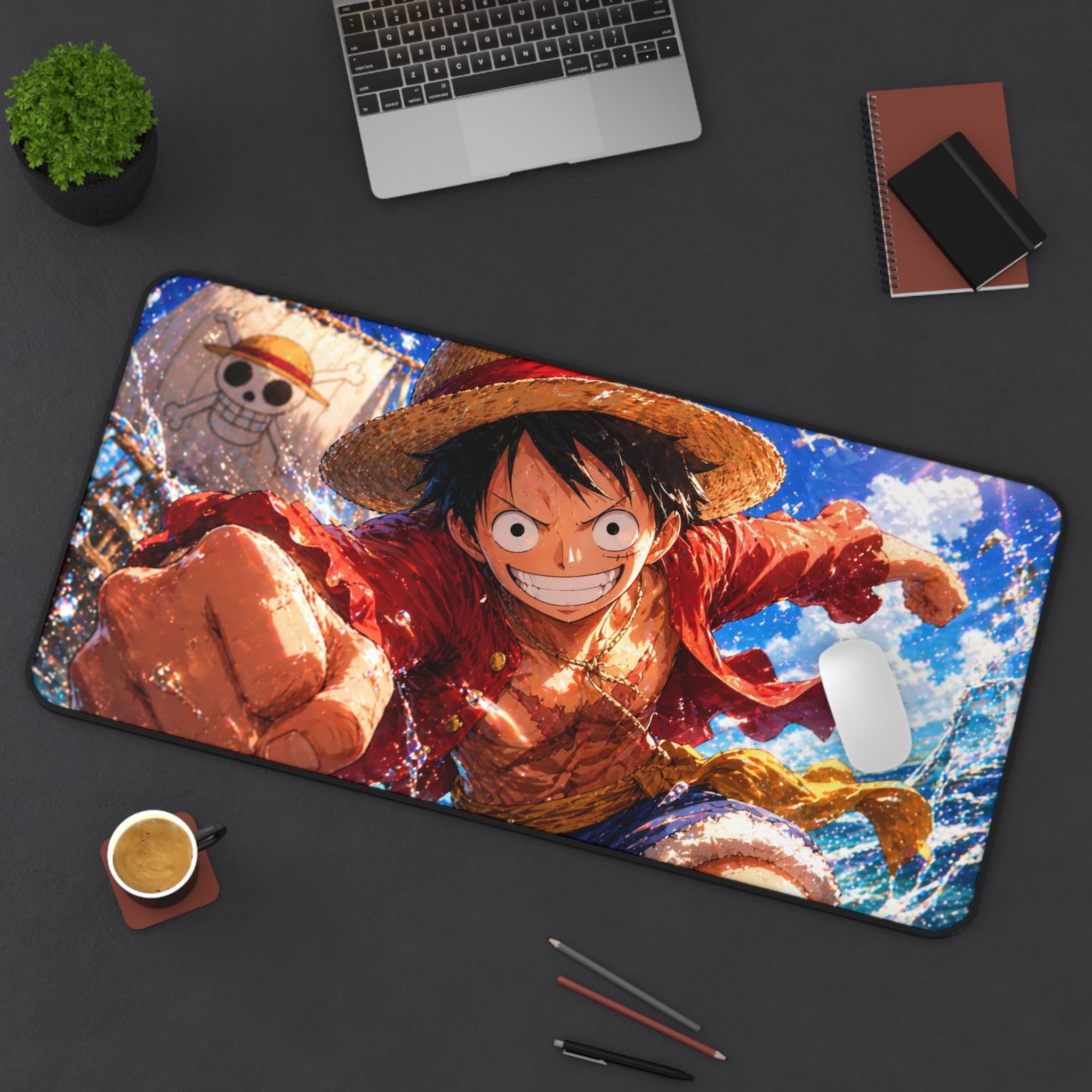 Anime character on a large mouse pad with a laptop, coffee, and stationery items on a desk.