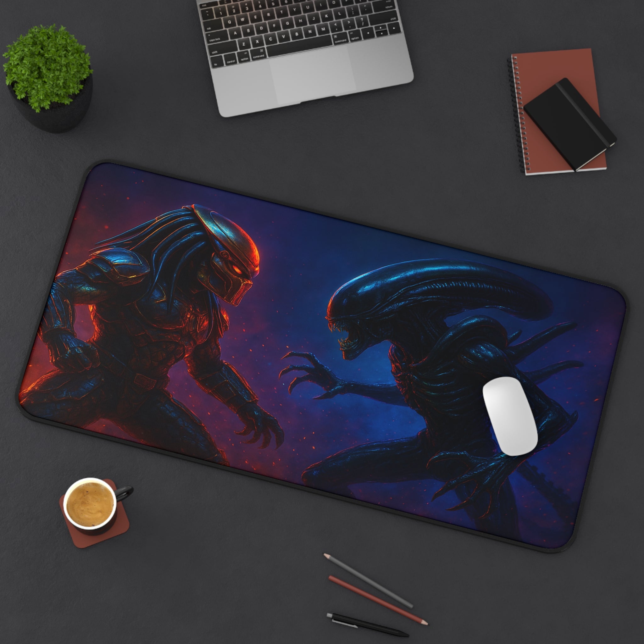 Mouse pad with alien and predator design on a desk with laptop and office items.