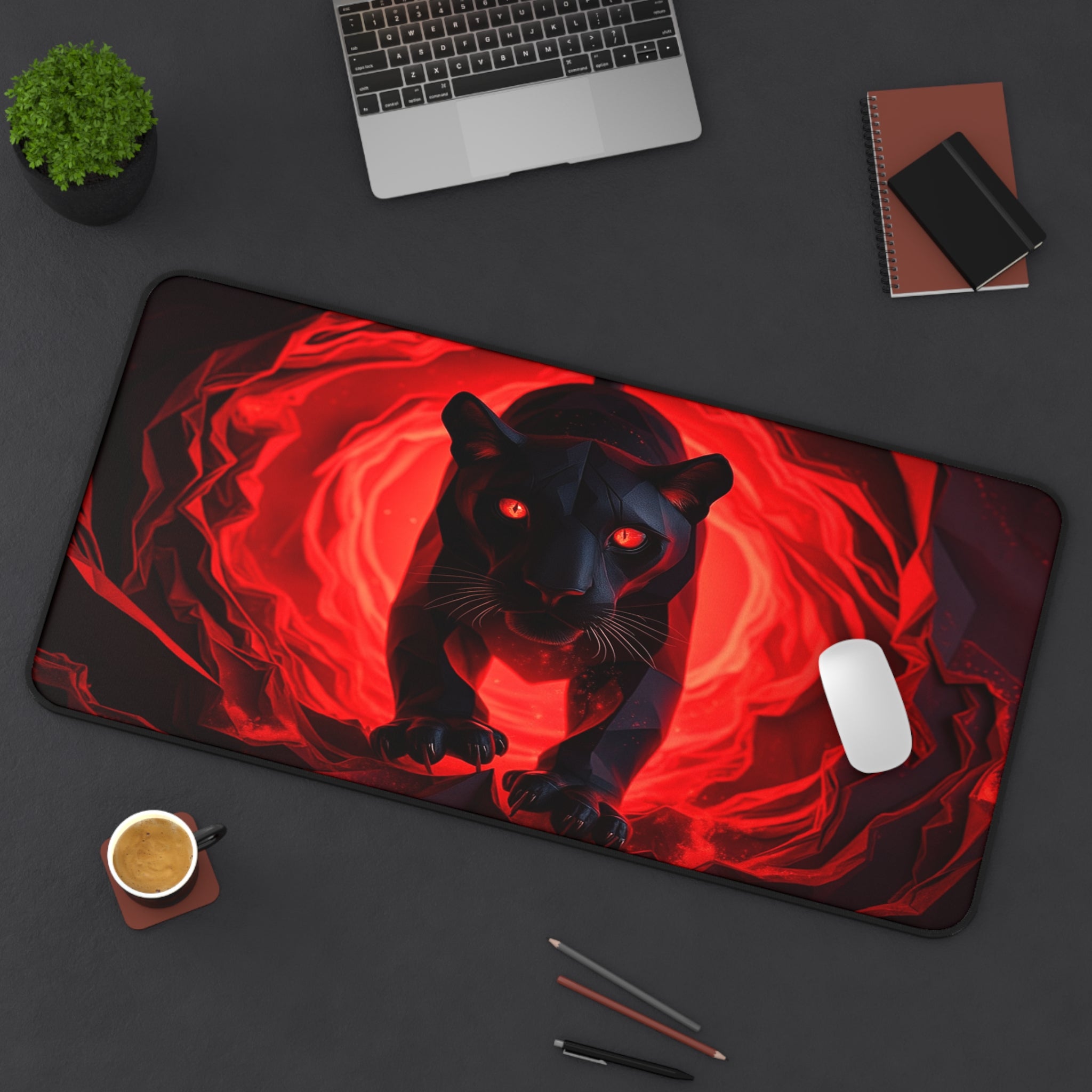 Mouse pad with a black panther design on a desk with a laptop and other items.